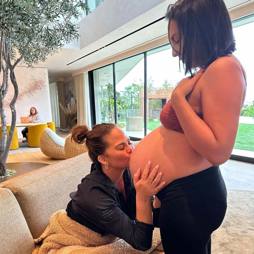 Chrissy Teigen with the surrogate