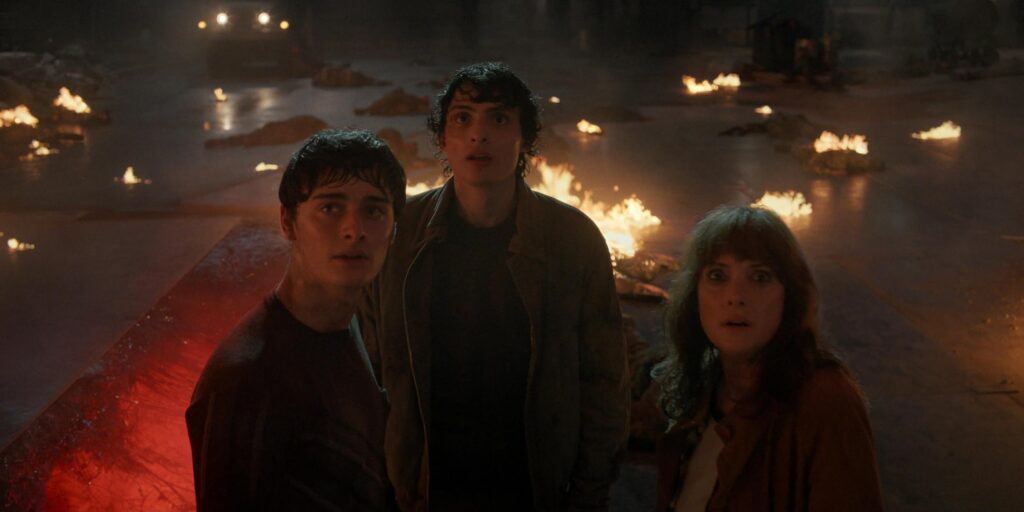 Winona Ryder, Finn Wolfhard, and Noah Schnapp in Chapter Five: Shock Jock (2025)