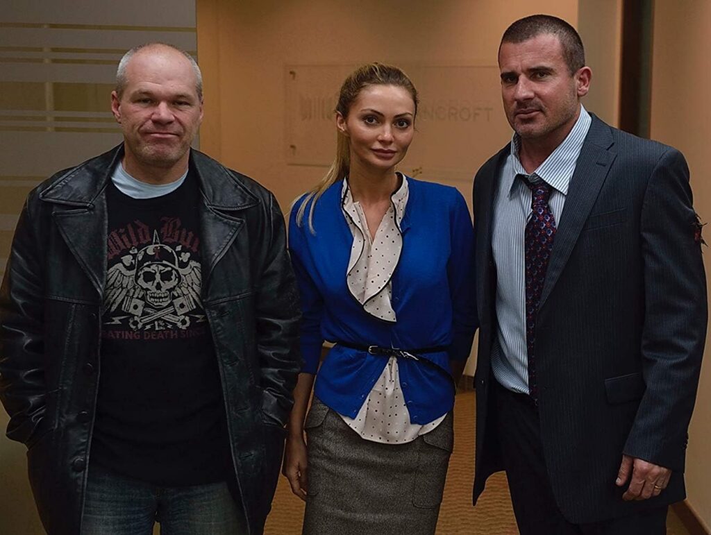 Uwe Boll, Dominic Purcell, and Gia Skova in Assault on Wall Street (2013)
