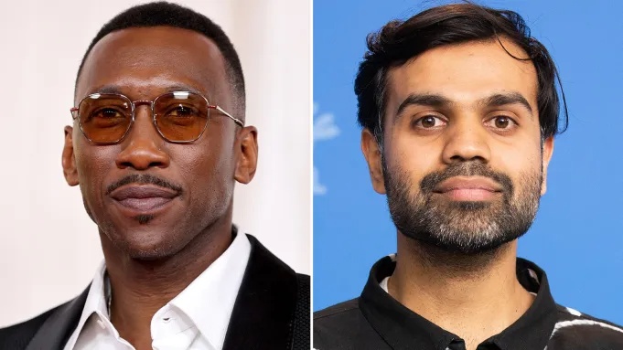 Two men side by side: left man wearing glasses with a white shirt and dark blazer; right man with a beard in a black shirt against a blue backdrop.