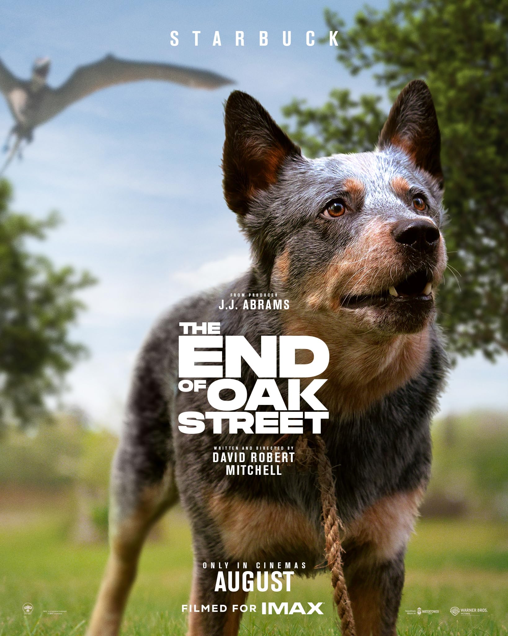 Dog in foreground on a movie poster, with the title 'The End of Oak Street' and a blue sky background.